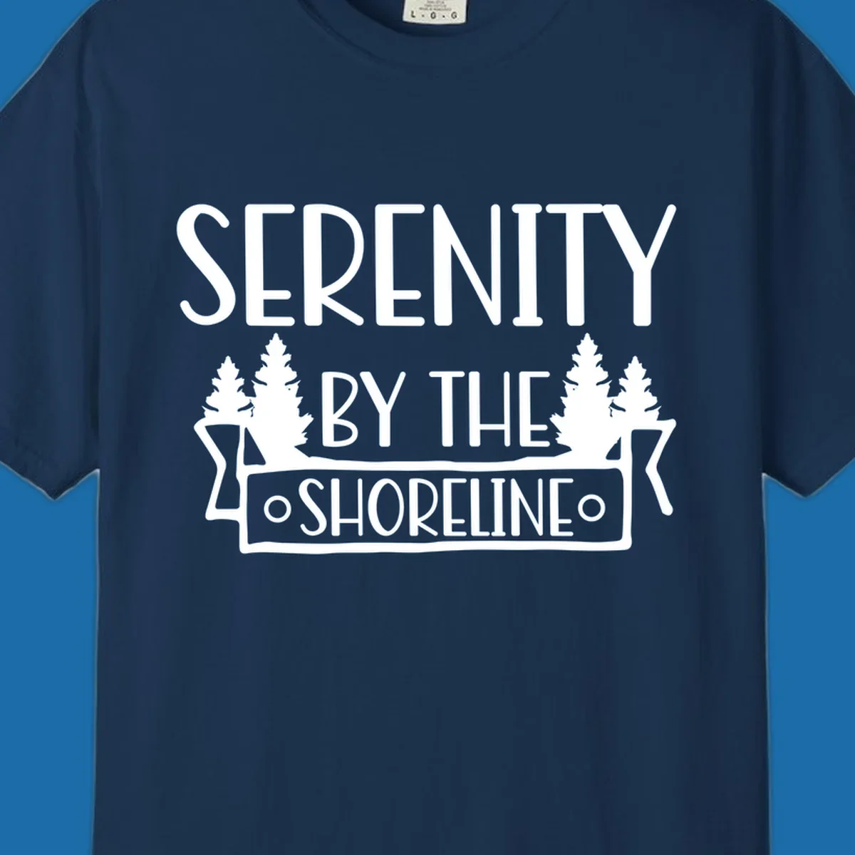 Serenity By The Shoreline text with pine trees and banner