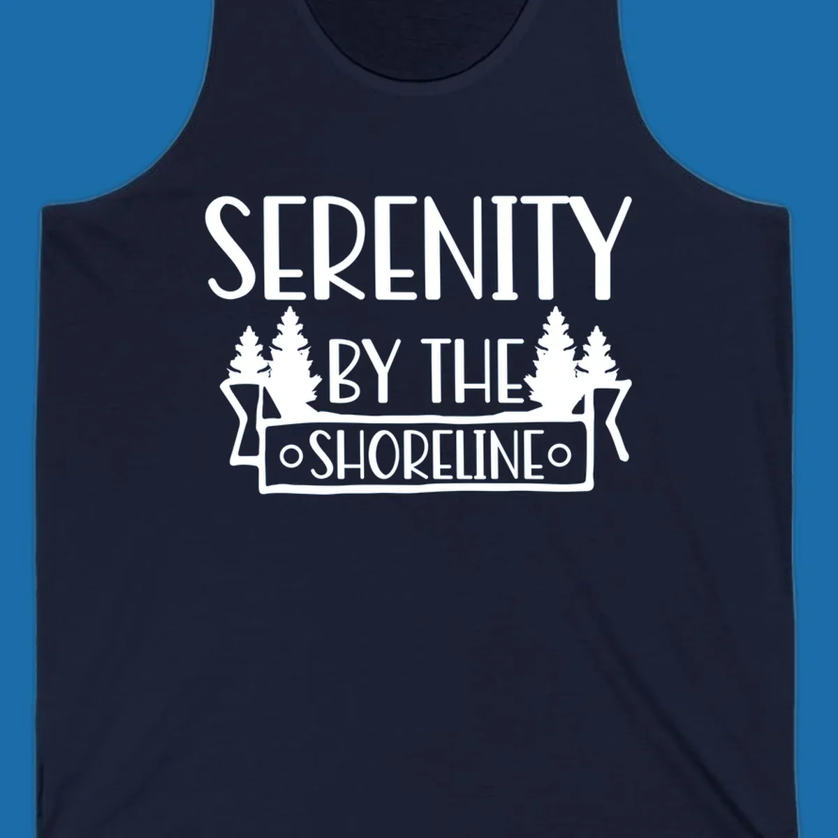 Serenity By The Shoreline text with pine trees and banner