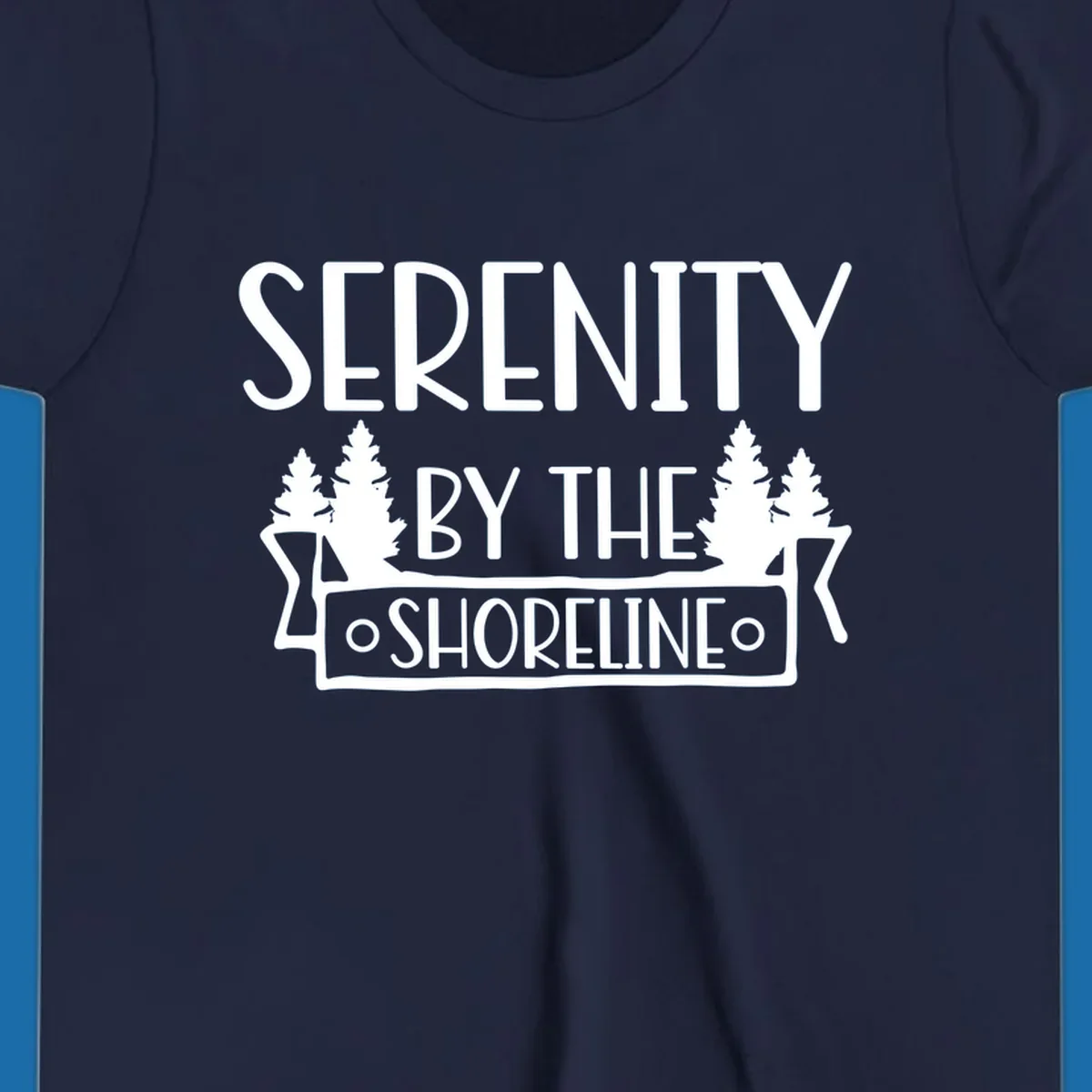 Serenity By The Shoreline text with pine trees and banner