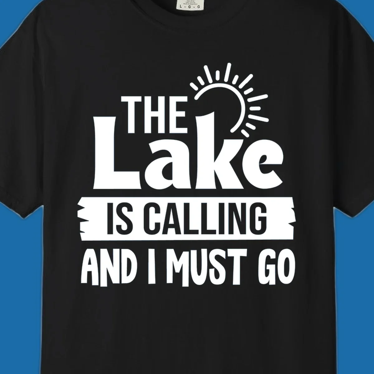 The Lake Is Calling And I Must Go text with a sun graphic. lake-calling-go