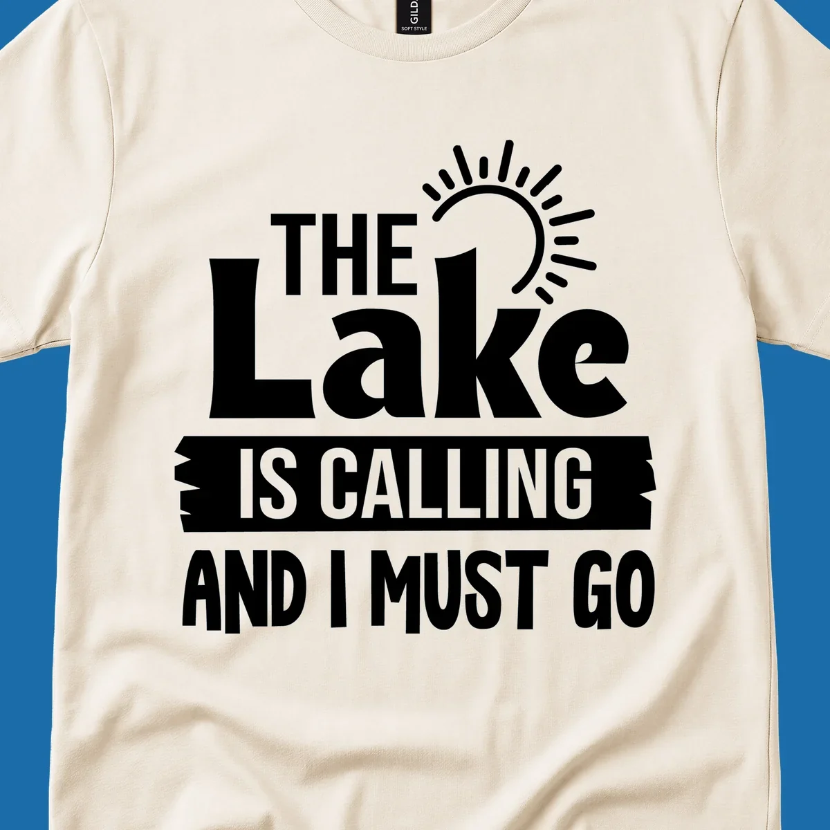 The Lake Is Calling And I Must Go text with a sun graphic. lake-calling-go