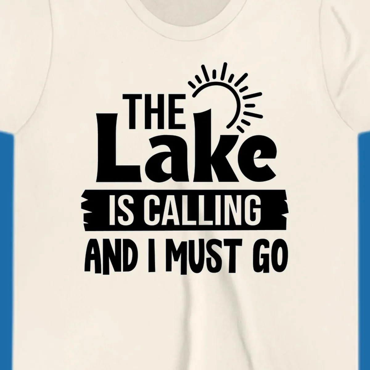 The Lake Is Calling And I Must Go text with a sun graphic. lake-calling-go