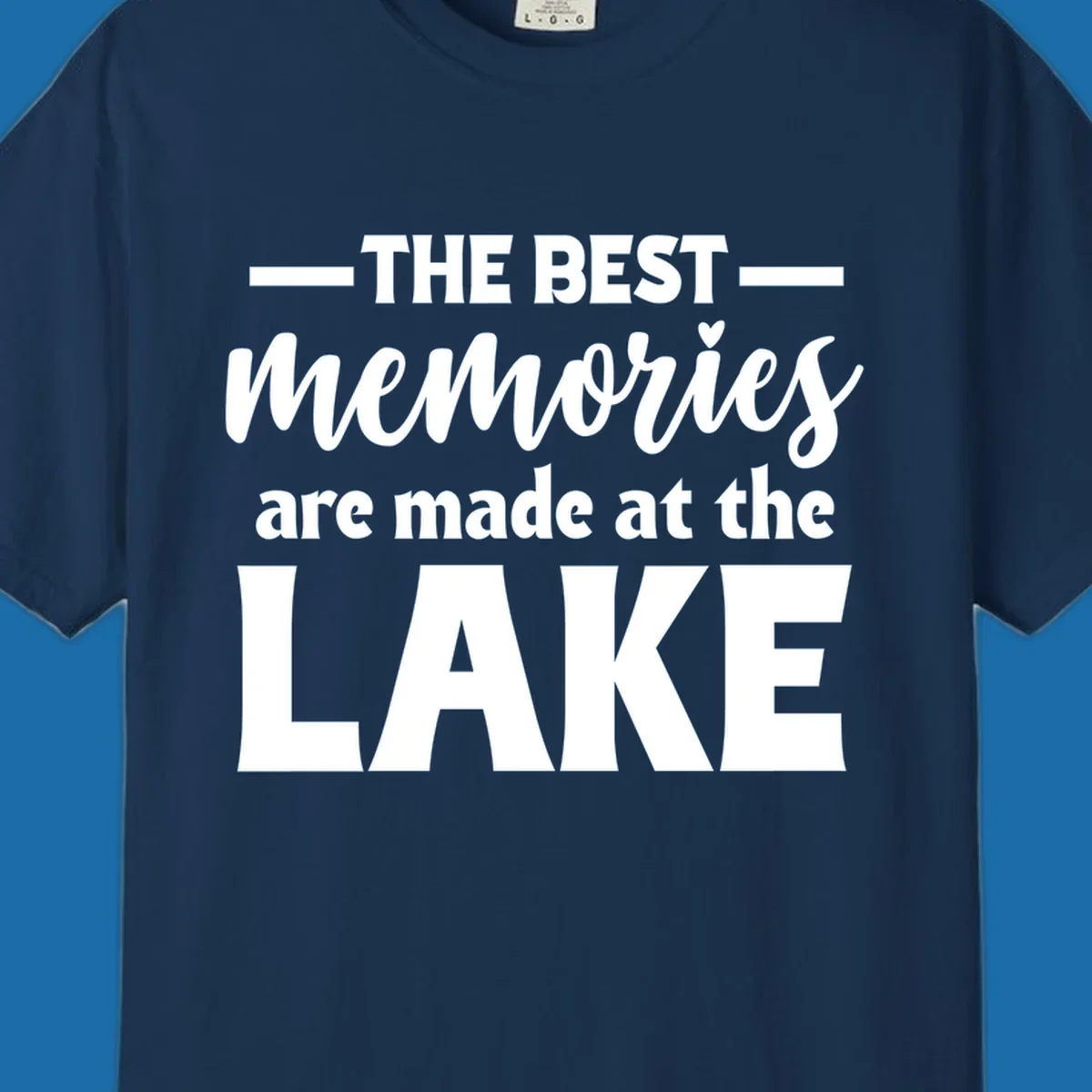 White typography design with the phrase 'THE BEST memories are made at the LAKE', featuring a heart accent.