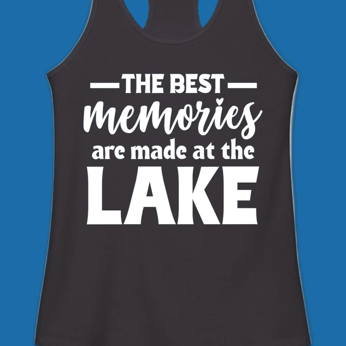 White typography design with the phrase 'THE BEST memories are made at the LAKE', featuring a heart accent.
