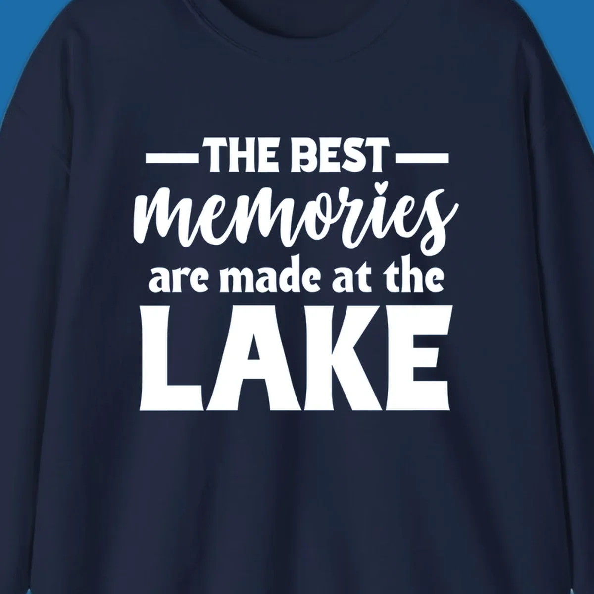 White typography design with the phrase 'THE BEST memories are made at the LAKE', featuring a heart accent.