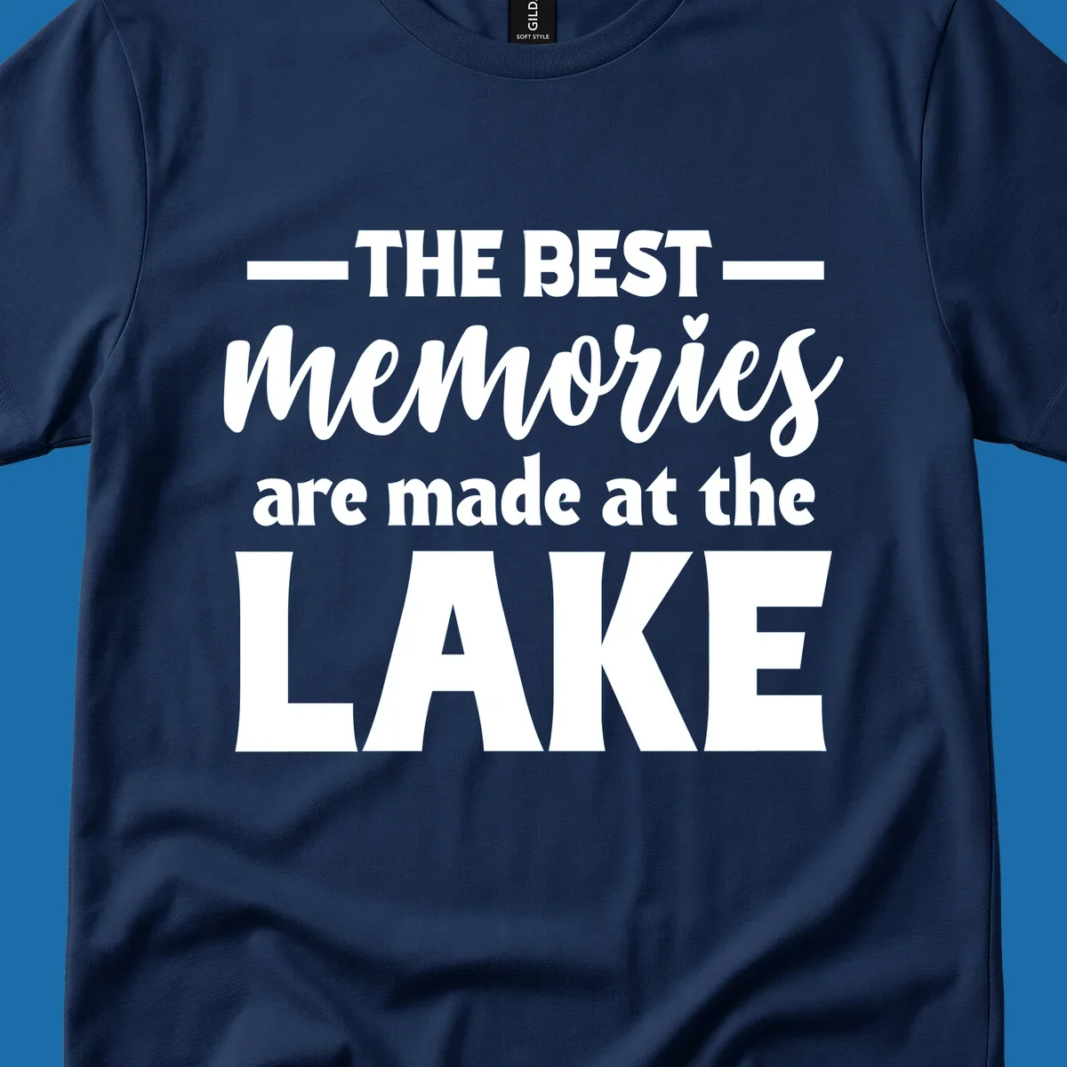 White typography design with the phrase 'THE BEST memories are made at the LAKE', featuring a heart accent.