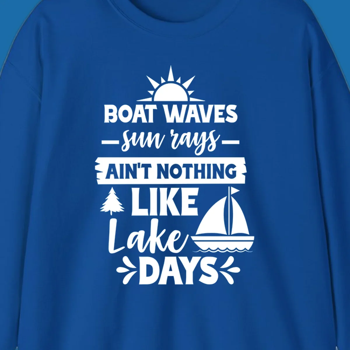 White text and graphics of sun rays, a sailboat, and a tree reading 'Boat Waves Sun Rays Ain't Nothing Like Lake Days'.