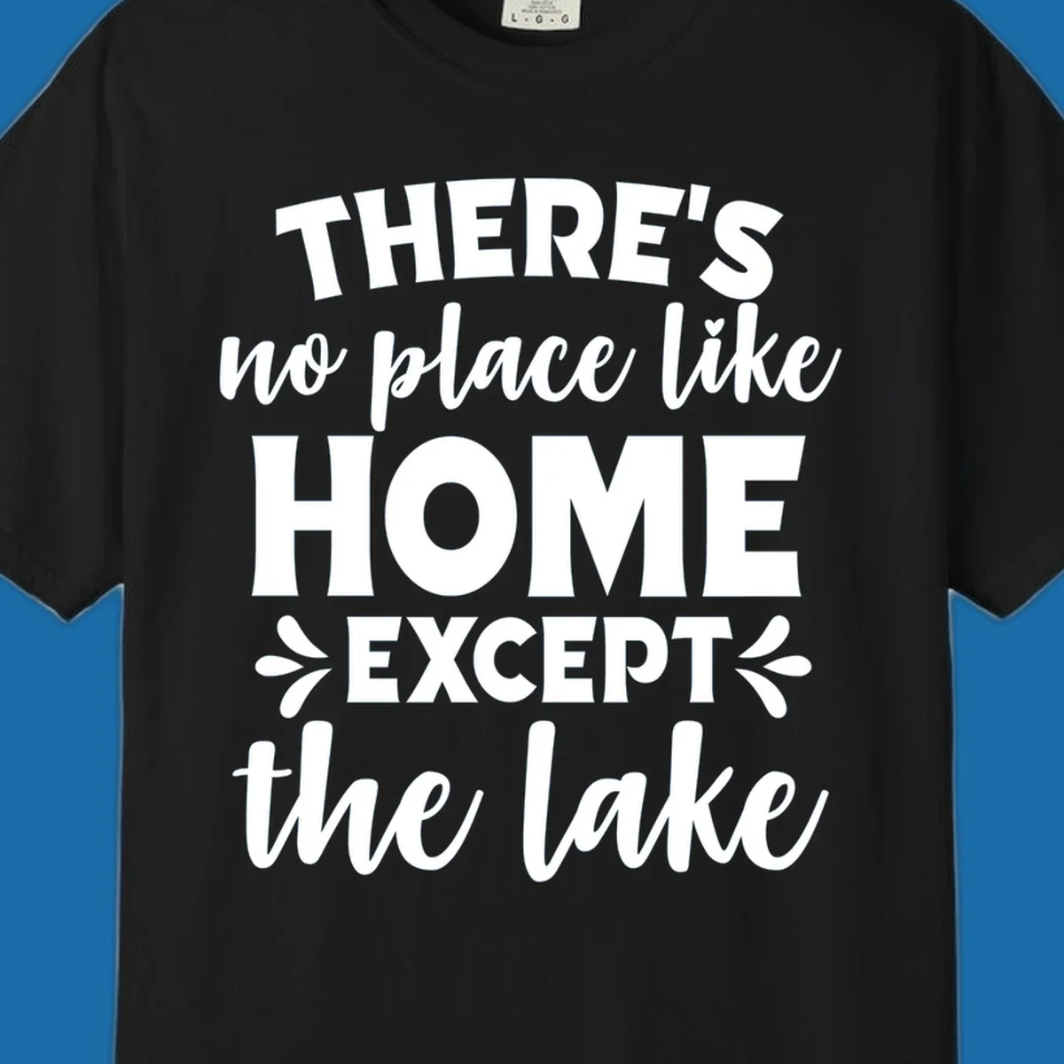 Typography design with the phrase "There's No Place Like Home Except The Lake" for lake-life apparel.