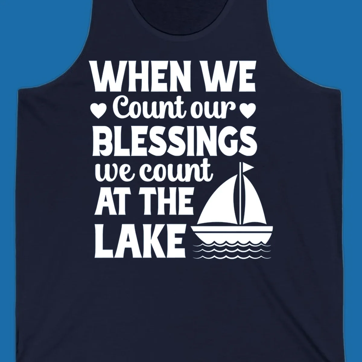 Text reads 'When We Count Our Blessings We Count At The Lake' with a sailboat graphic, lake-life-blessings design.