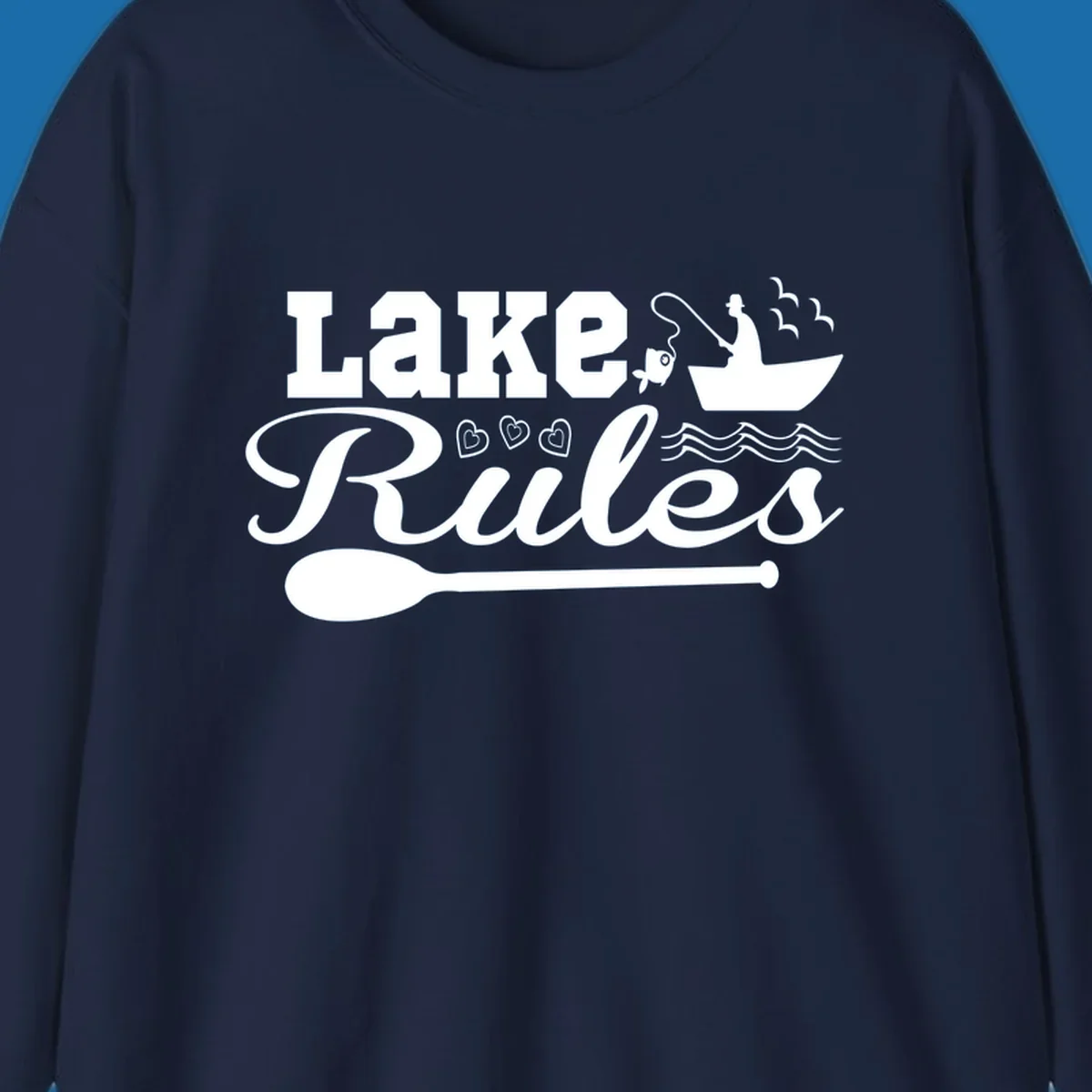 Lake Rules design with fishing boat, fish, oar, waves, and birds. White artwork on black and white backgrounds.