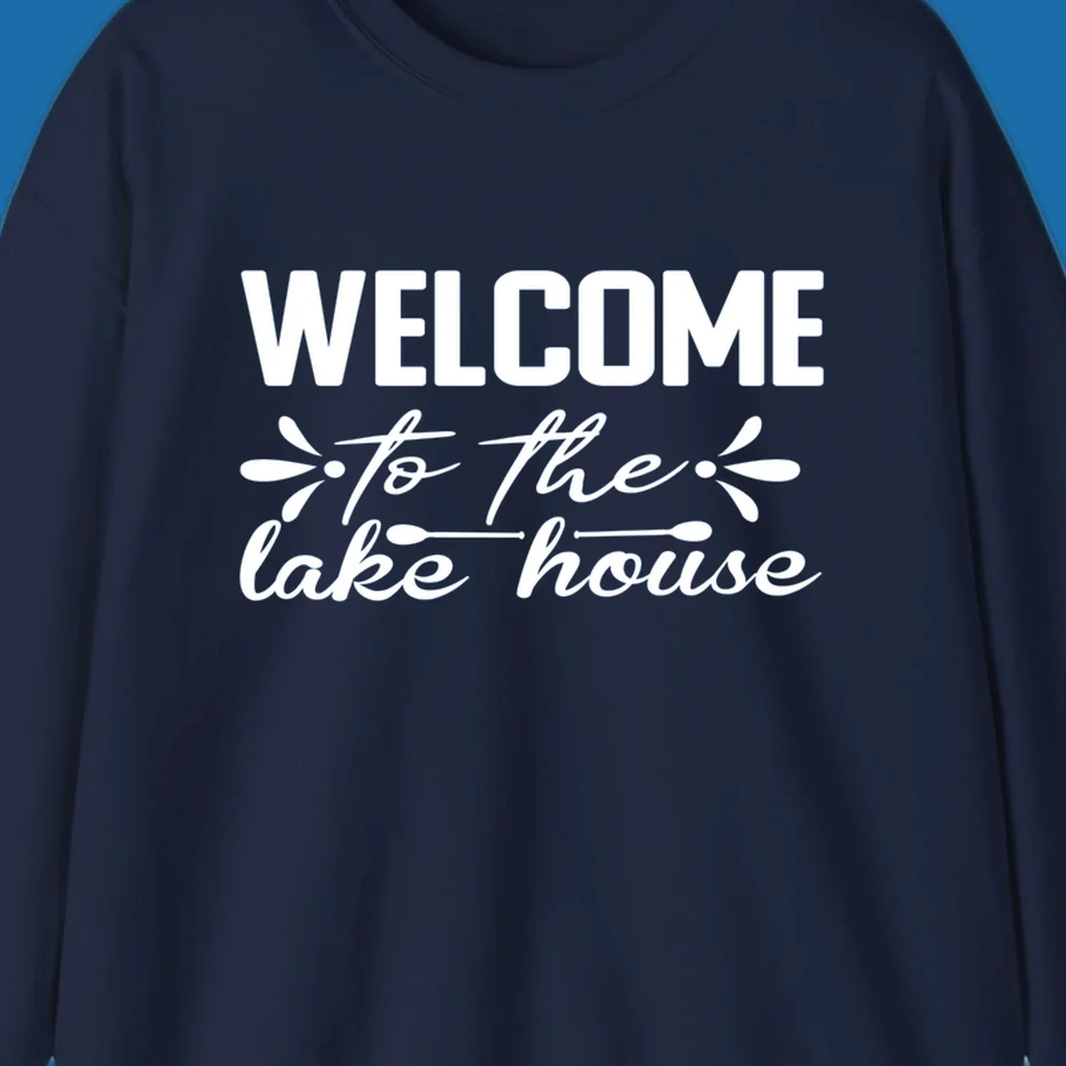 Welcome to the lake house text design with decorative elements.