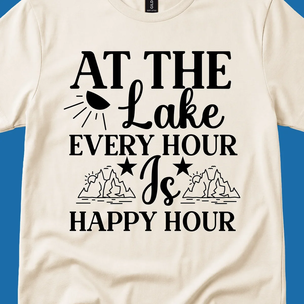 Lake happy hour text design with mountains, sun, and water illustrations.