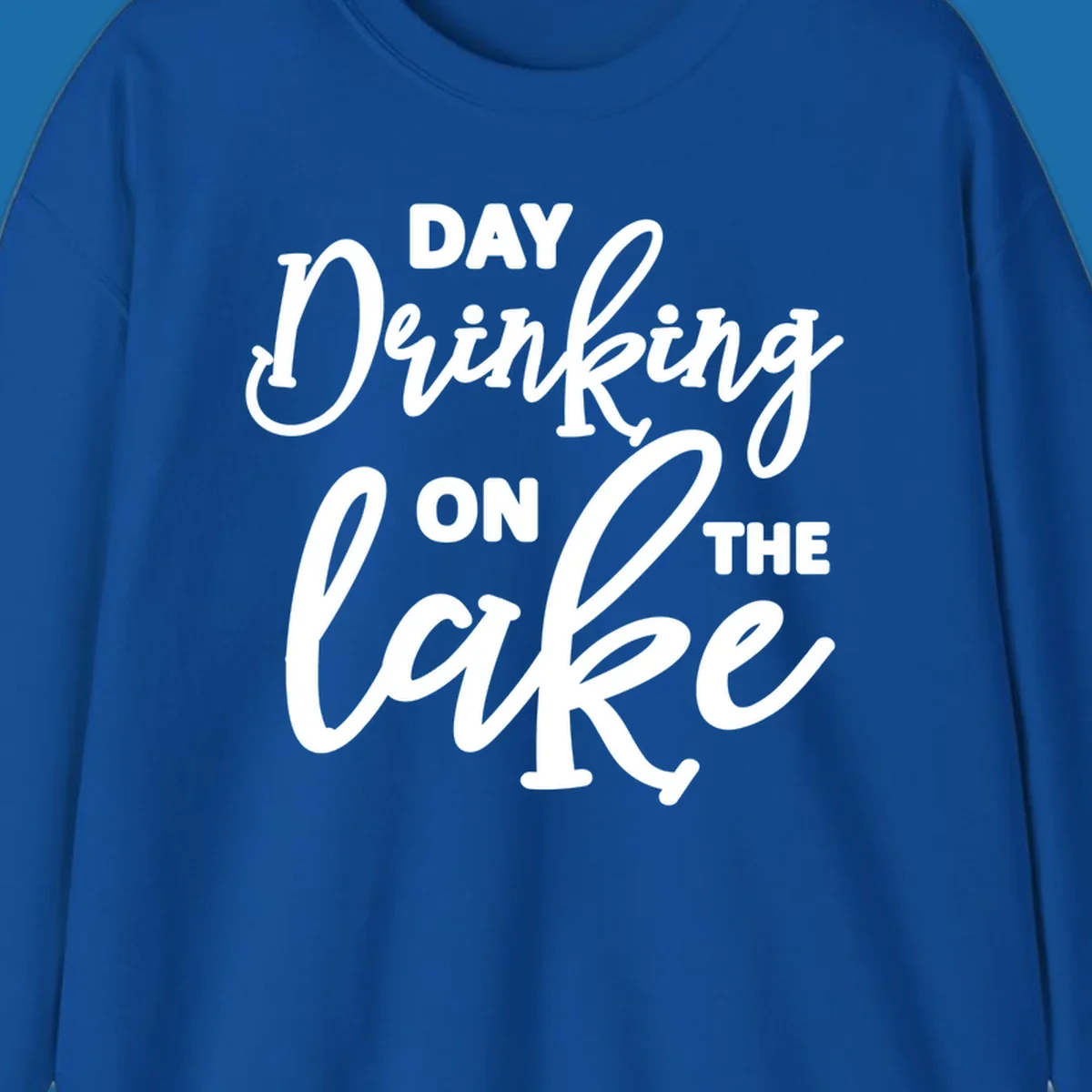 Typography design reading 'Day Drinking On The Lake' for lake day apparel.
