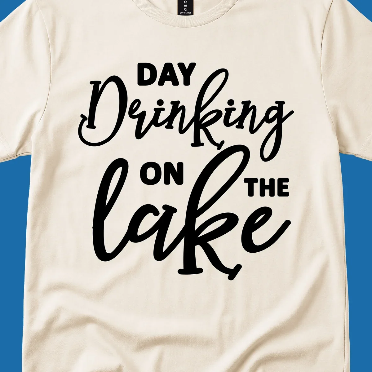 Typography design reading 'Day Drinking On The Lake' for lake day apparel.