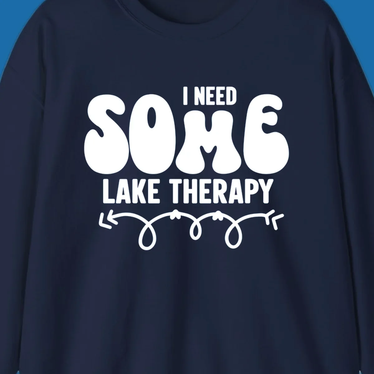 White "I Need Some Lake Therapy" text design with decorative wavy arrow line.