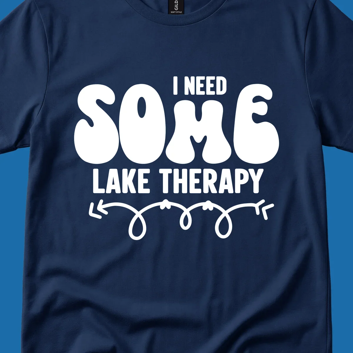 White "I Need Some Lake Therapy" text design with decorative wavy arrow line.