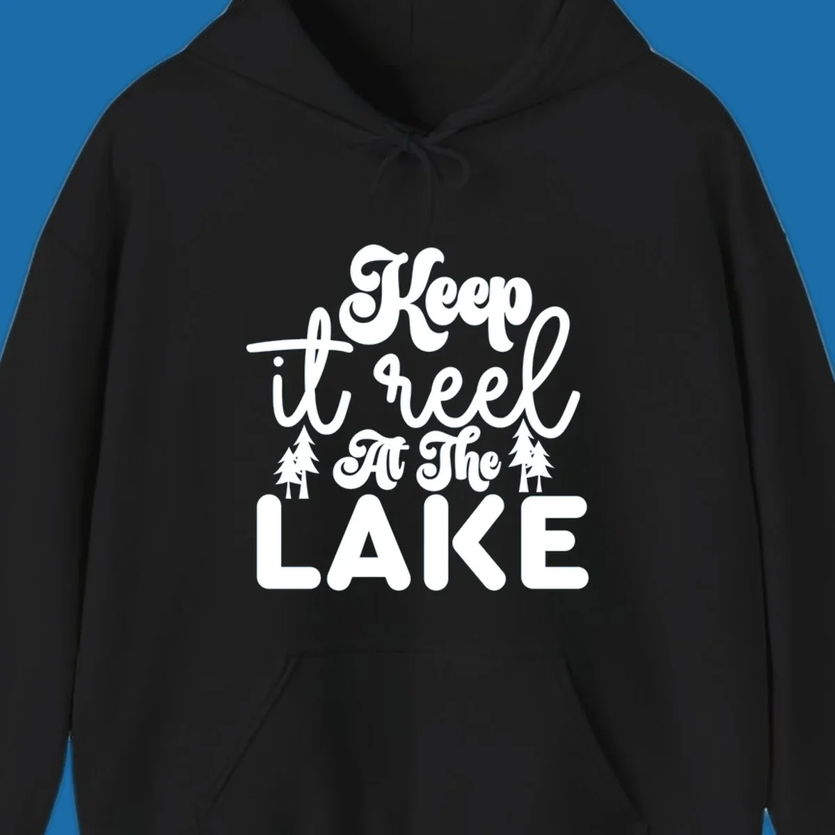 Keep it reel at the lake typography design with pine trees.