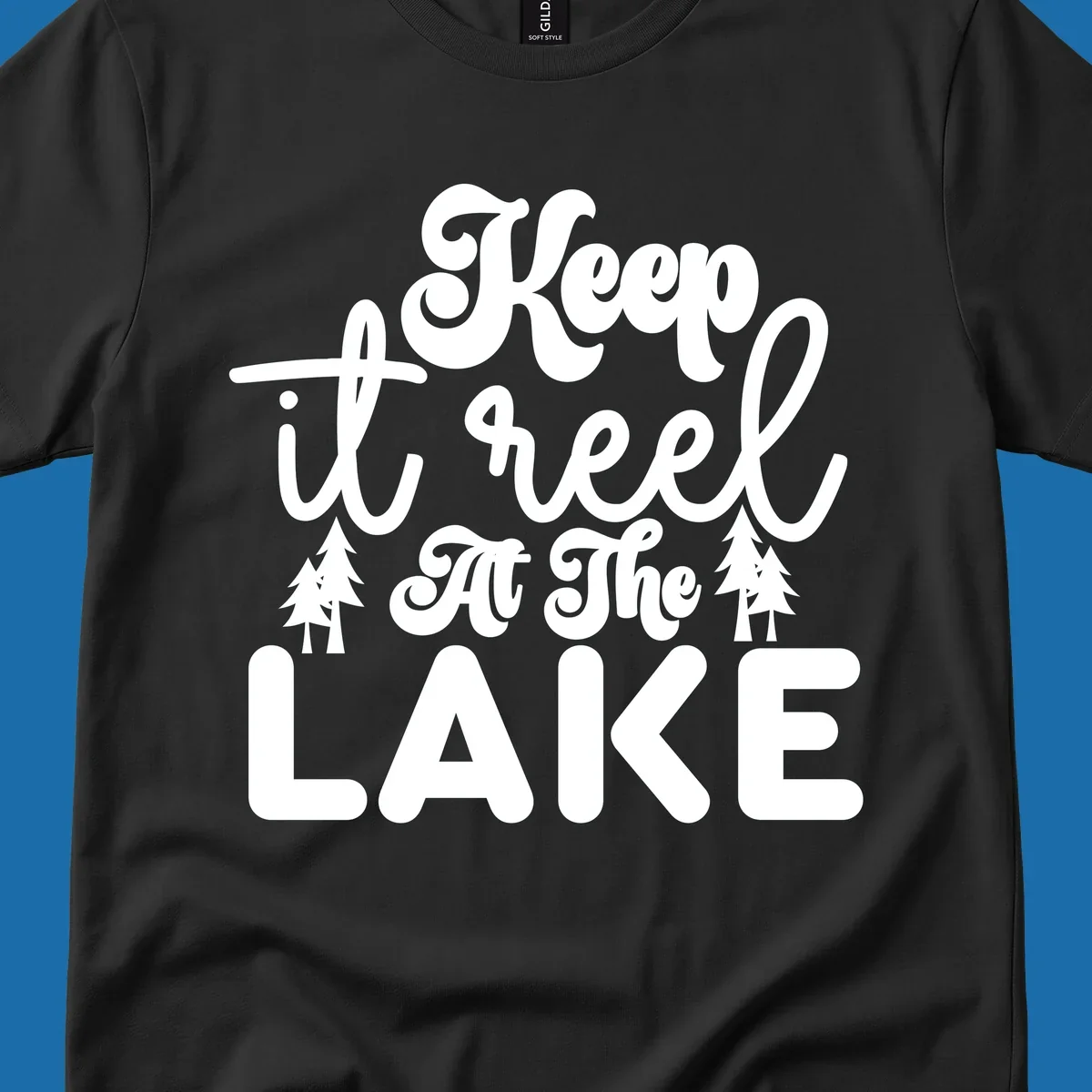 Keep it reel at the lake typography design with pine trees.