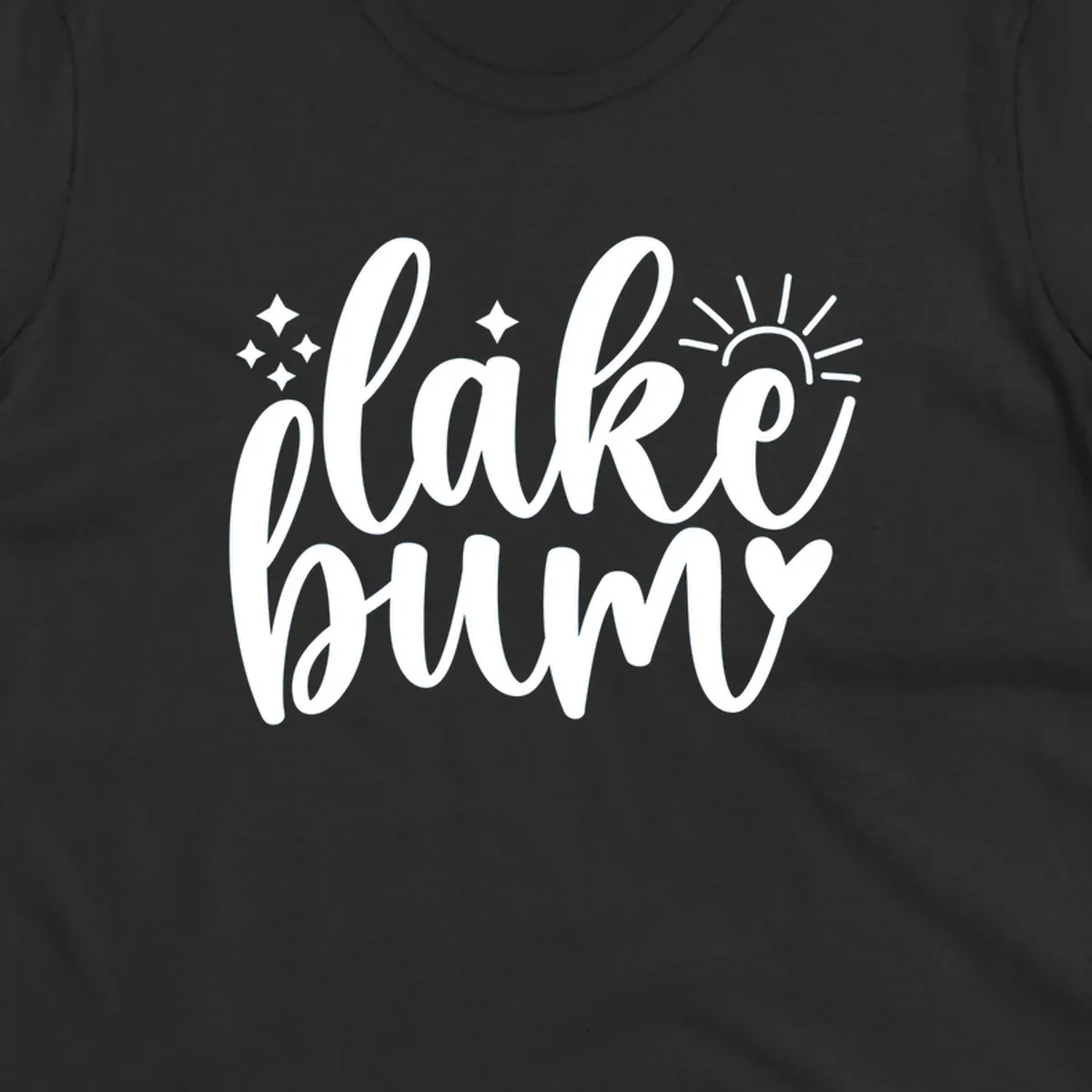 Lake bum text design with sun, sparkles, and heart graphic.