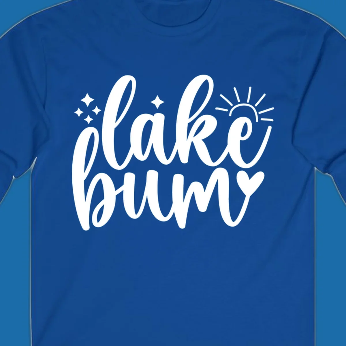 Lake bum text design with sun, sparkles, and heart graphic.