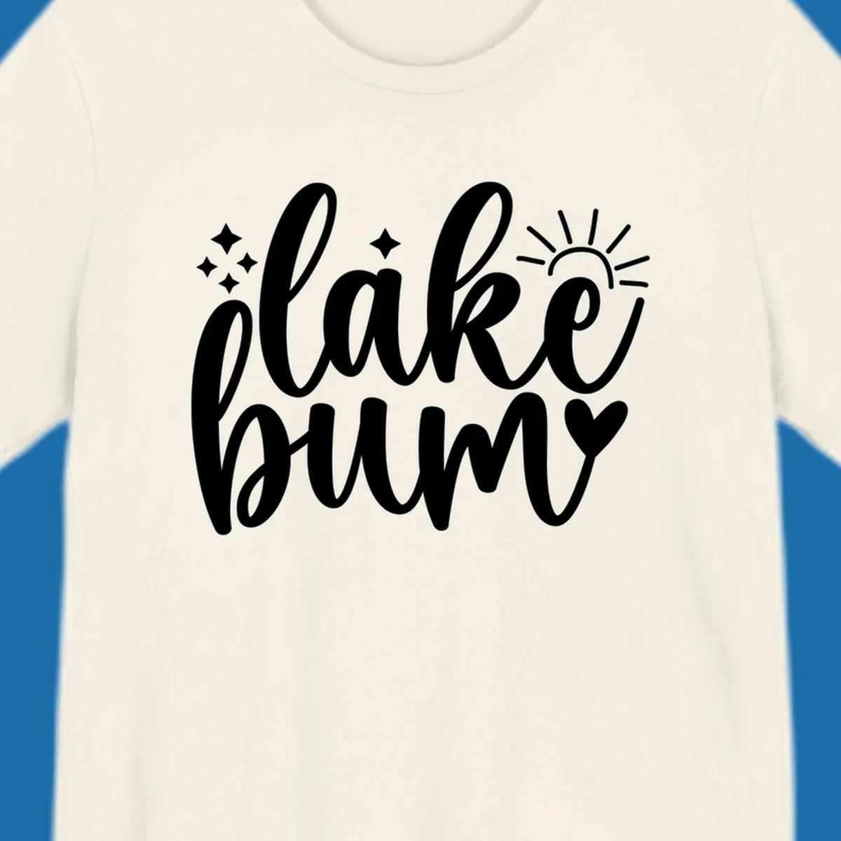 Lake bum text design with sun, sparkles, and heart graphic.