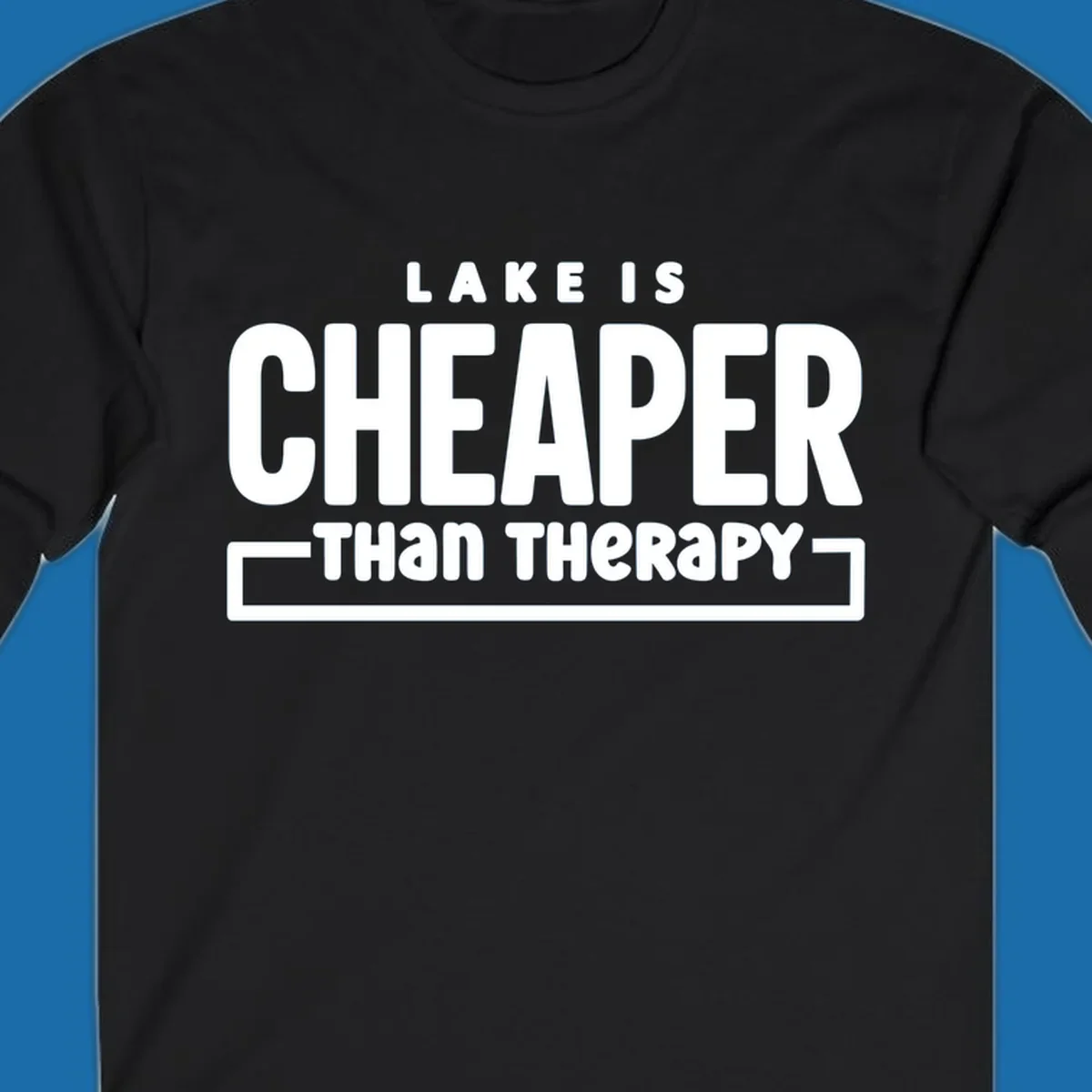 White text reads "LAKE IS CHEAPER THAN THERAPY", a humorous phrase about lake life.
