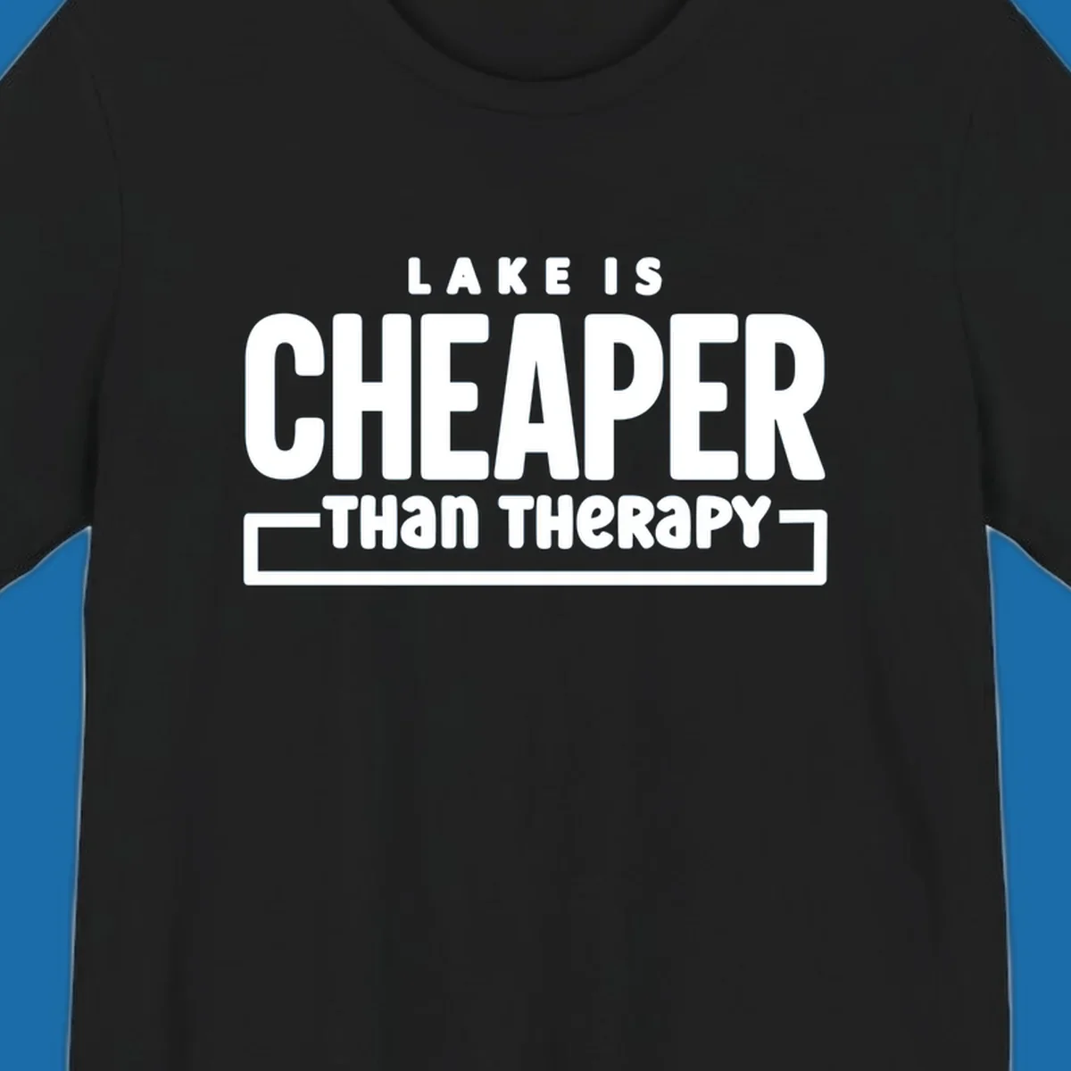 White text reads "LAKE IS CHEAPER THAN THERAPY", a humorous phrase about lake life.