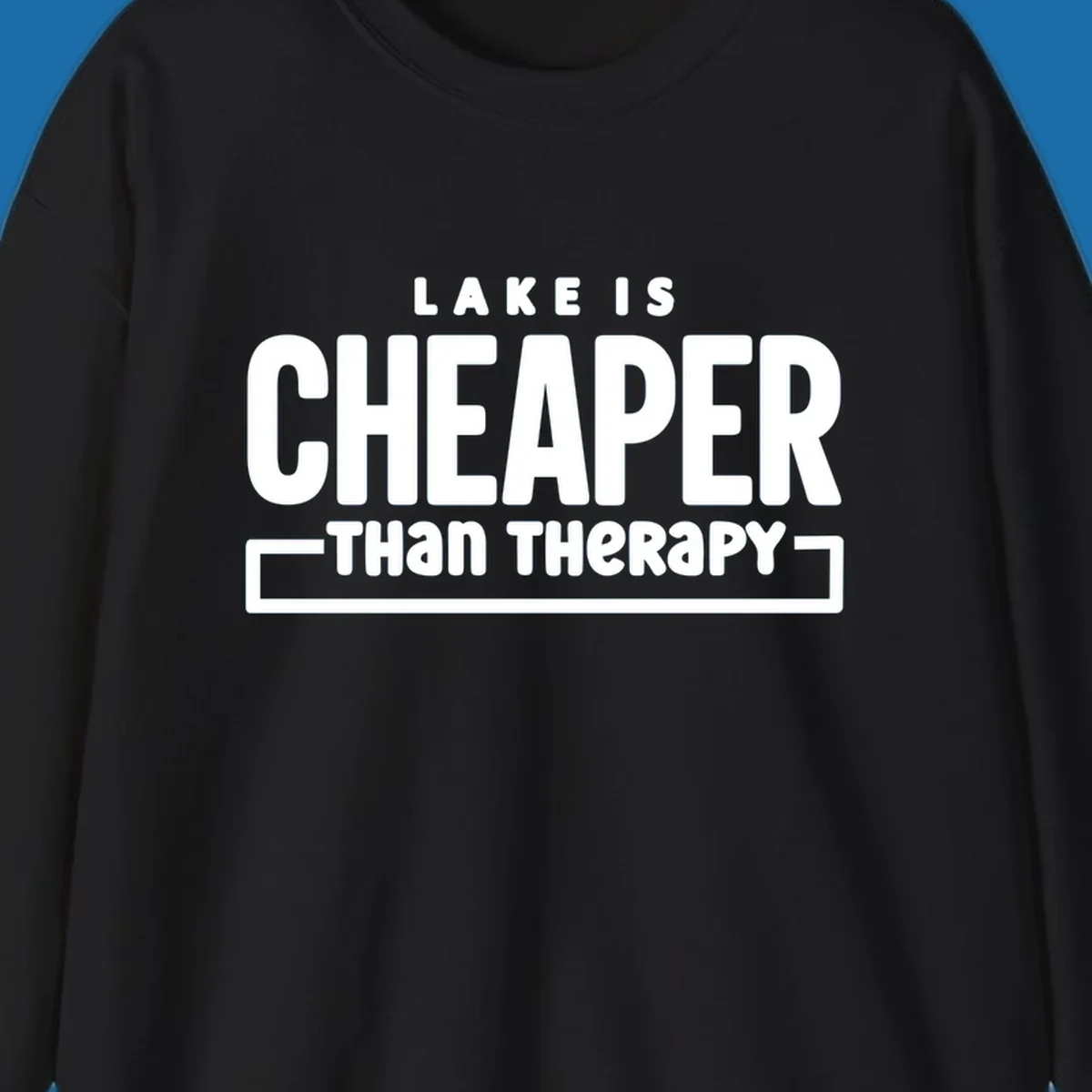 White text reads "LAKE IS CHEAPER THAN THERAPY", a humorous phrase about lake life.