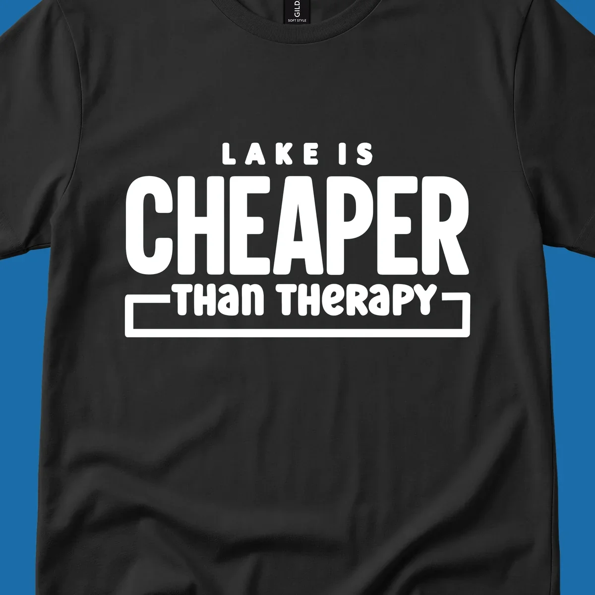 White text reads "LAKE IS CHEAPER THAN THERAPY", a humorous phrase about lake life.