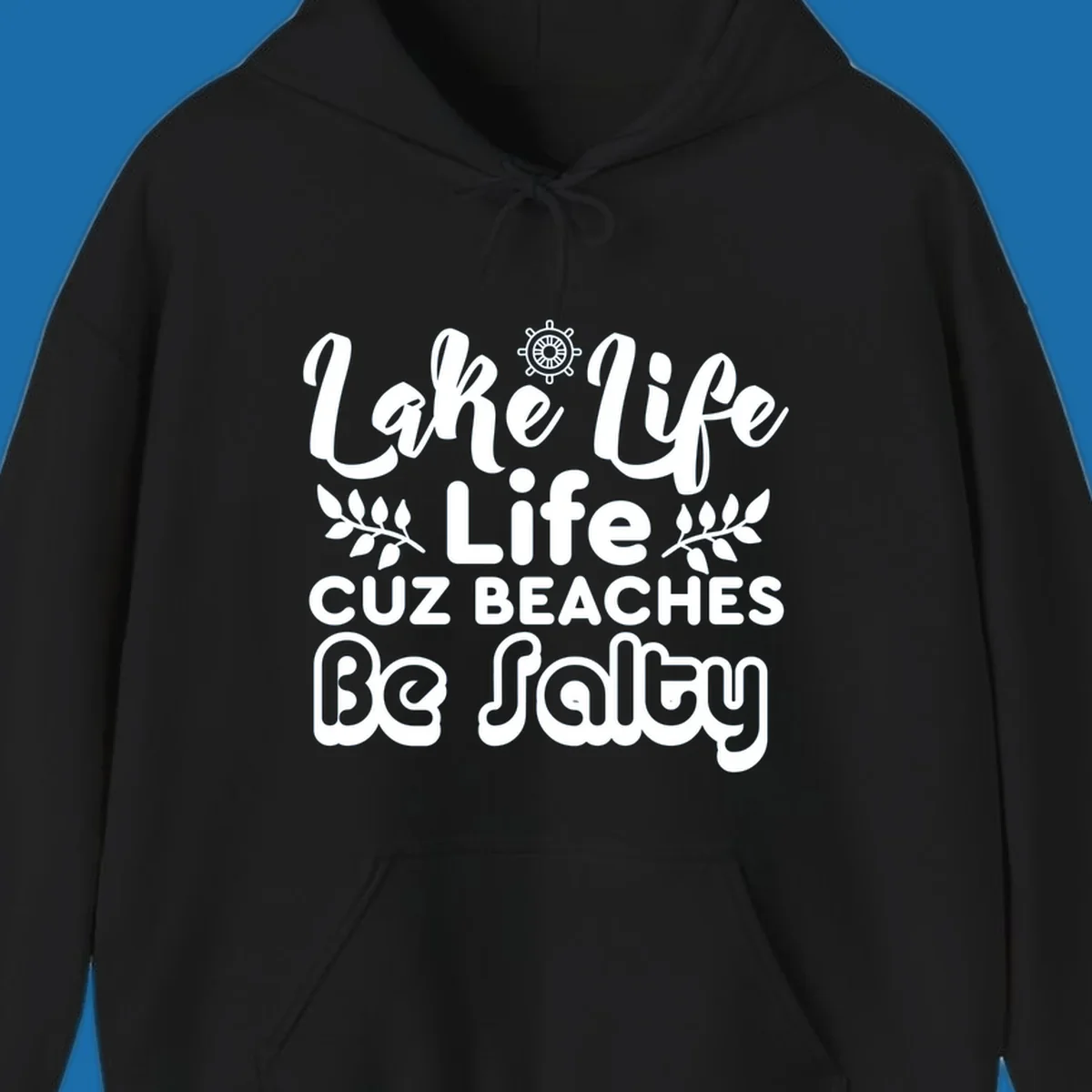 Lake Life Cuz Beaches Be Salty typography design with ship wheel and leaf accents.
