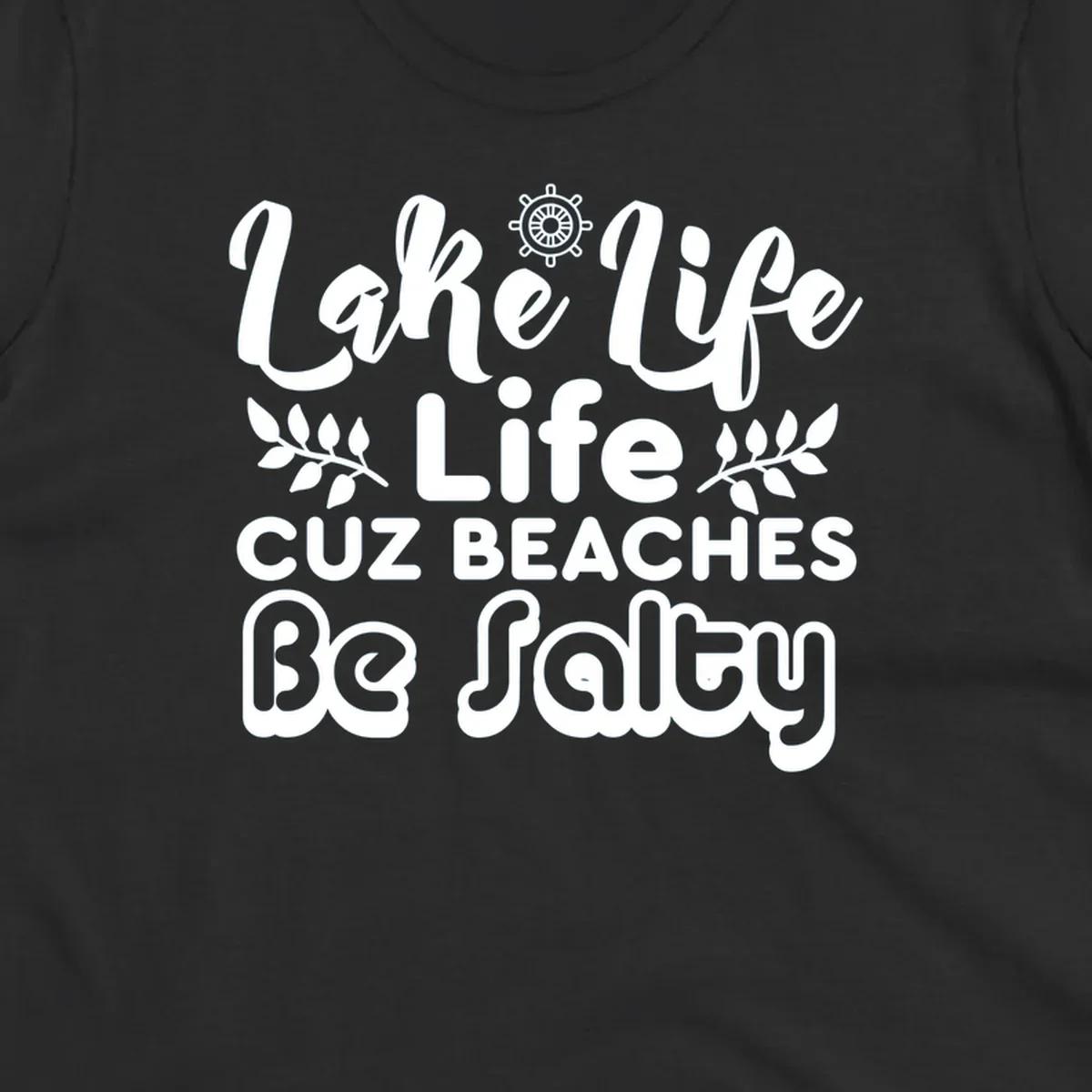 Lake Life Cuz Beaches Be Salty typography design with ship wheel and leaf accents.