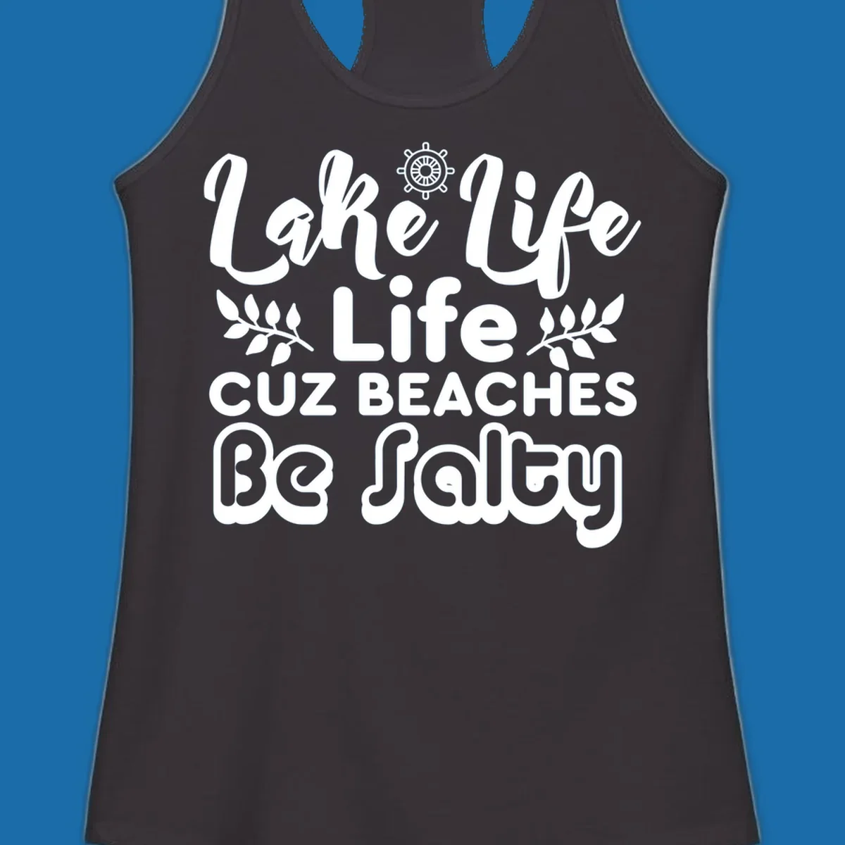 Lake Life Cuz Beaches Be Salty typography design with ship wheel and leaf accents.