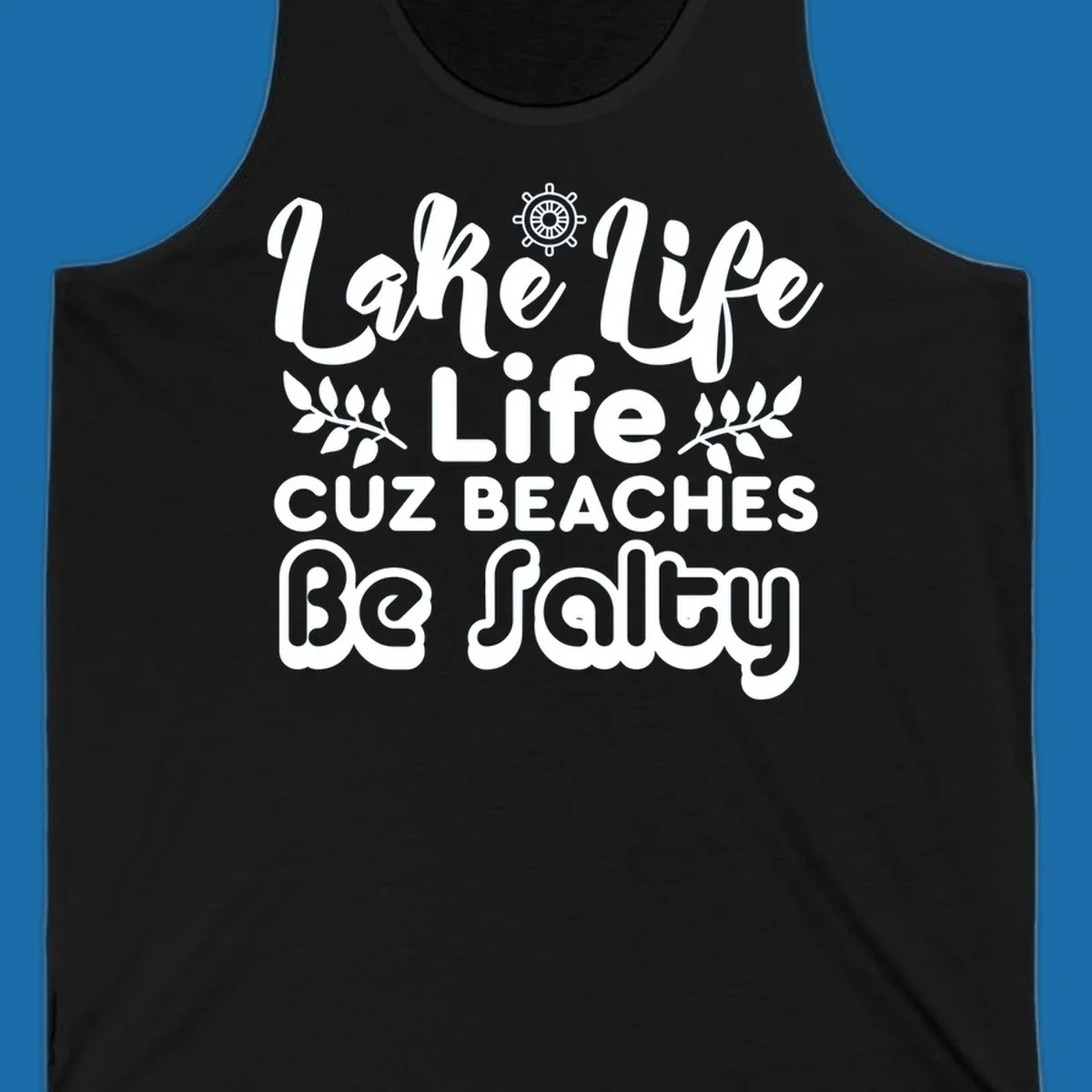 Lake Life Cuz Beaches Be Salty typography design with ship wheel and leaf accents.