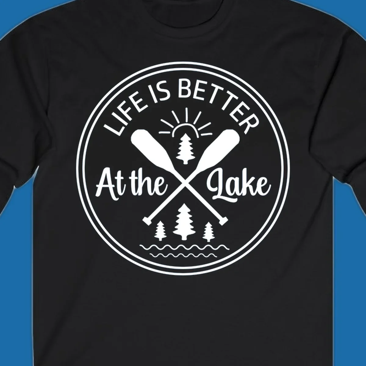 Life is better at the lake circular badge with oars, trees, sun, and waves.