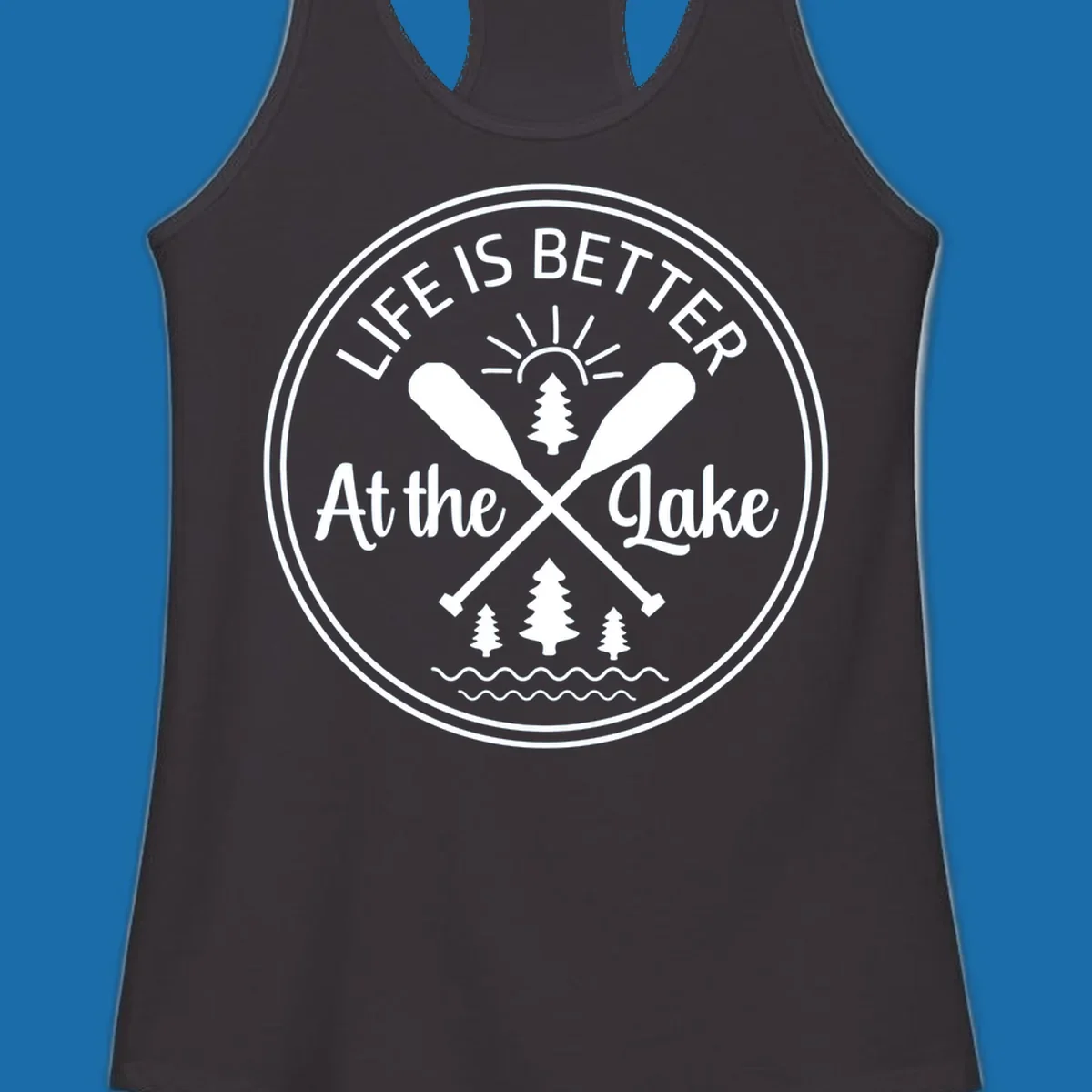 Life is better at the lake circular badge with oars, trees, sun, and waves.