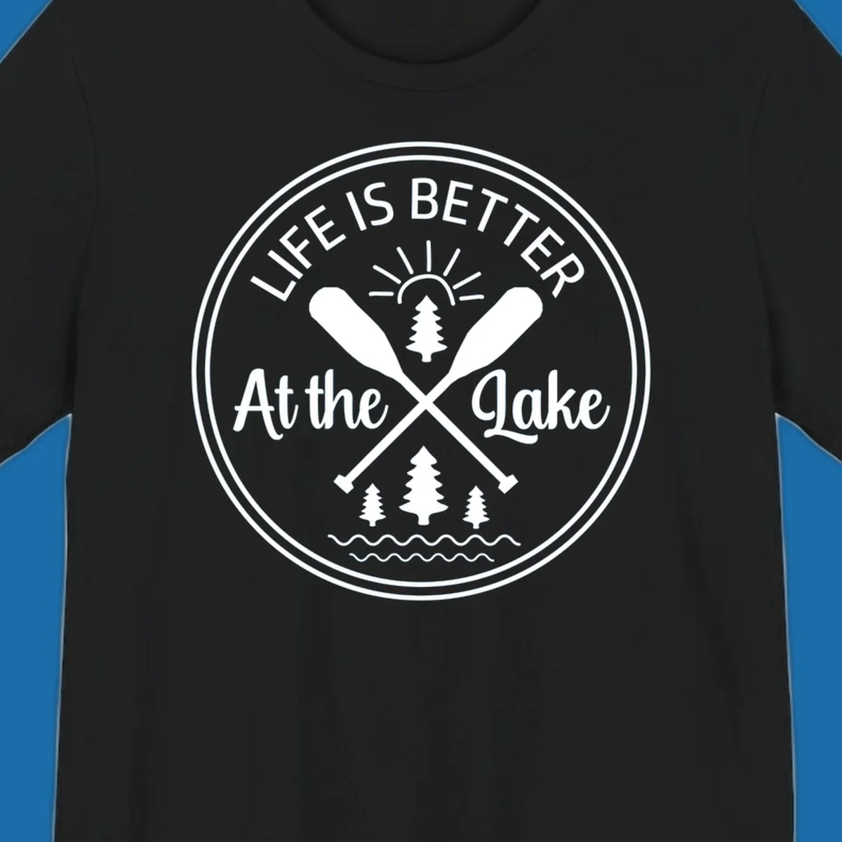 Life is better at the lake circular badge with oars, trees, sun, and waves.