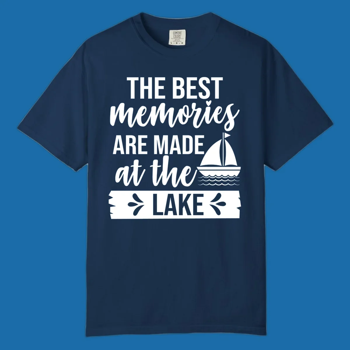 The Best Memories Are Made At The Lake text with sailboat graphic