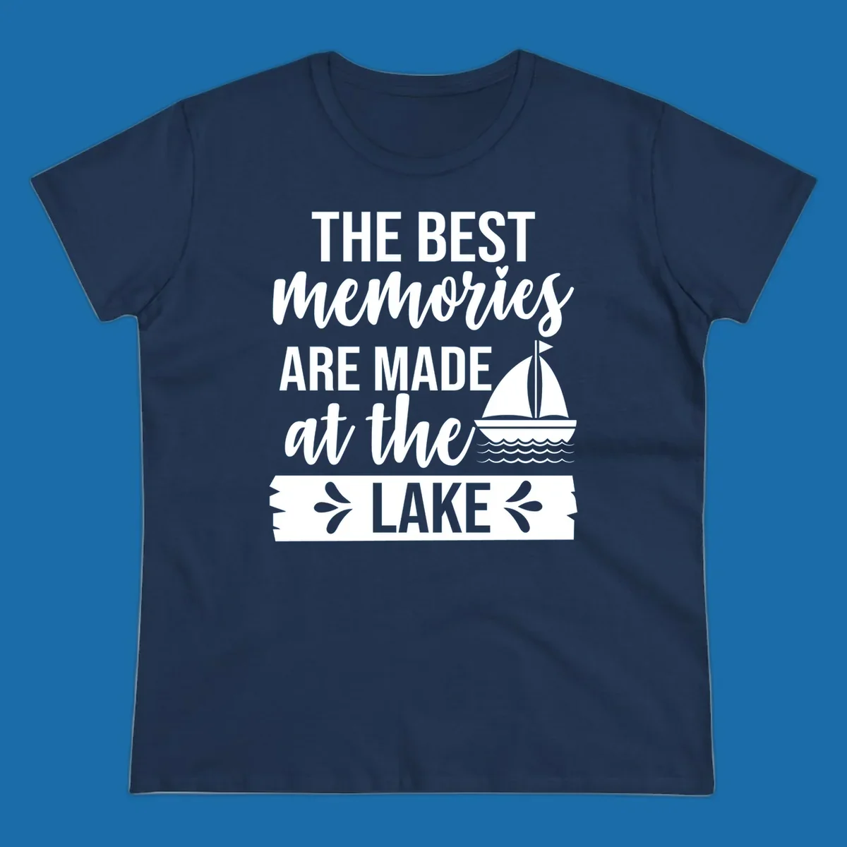 The Best Memories Are Made At The Lake text with sailboat graphic