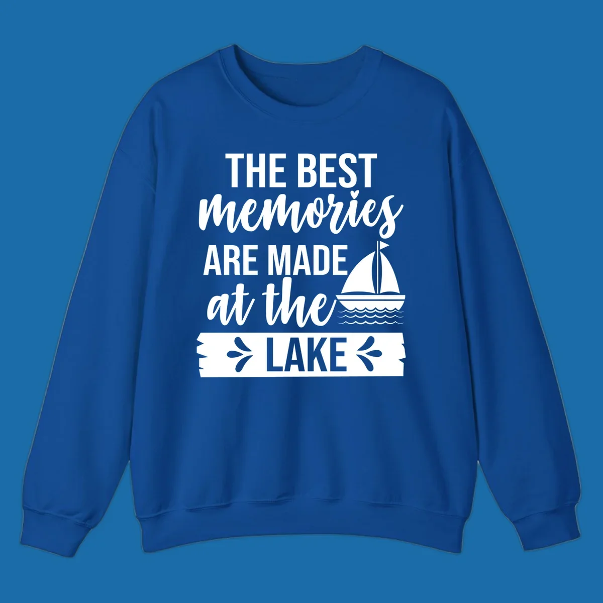 The Best Memories Are Made At The Lake text with sailboat graphic