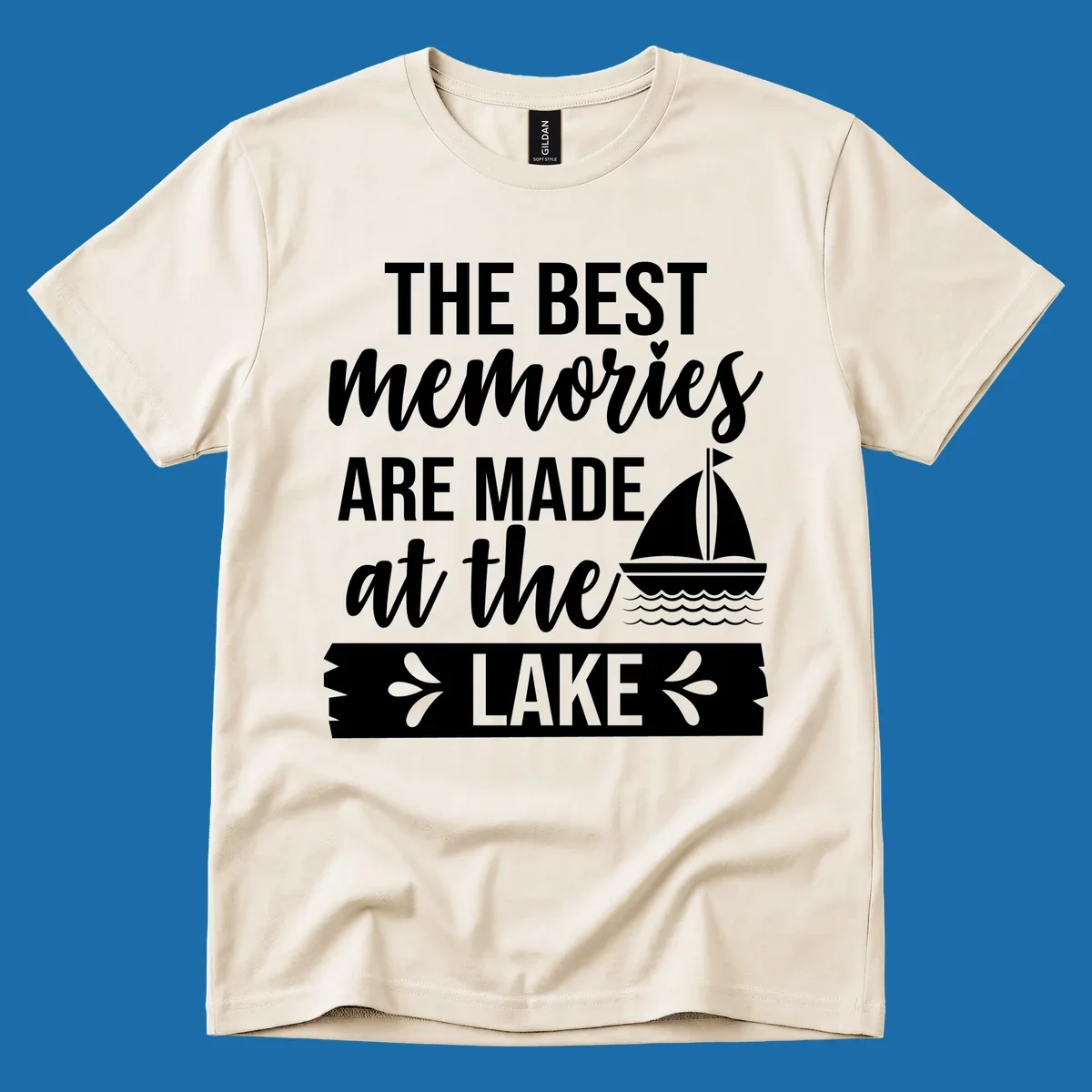 The Best Memories Are Made At The Lake text with sailboat graphic