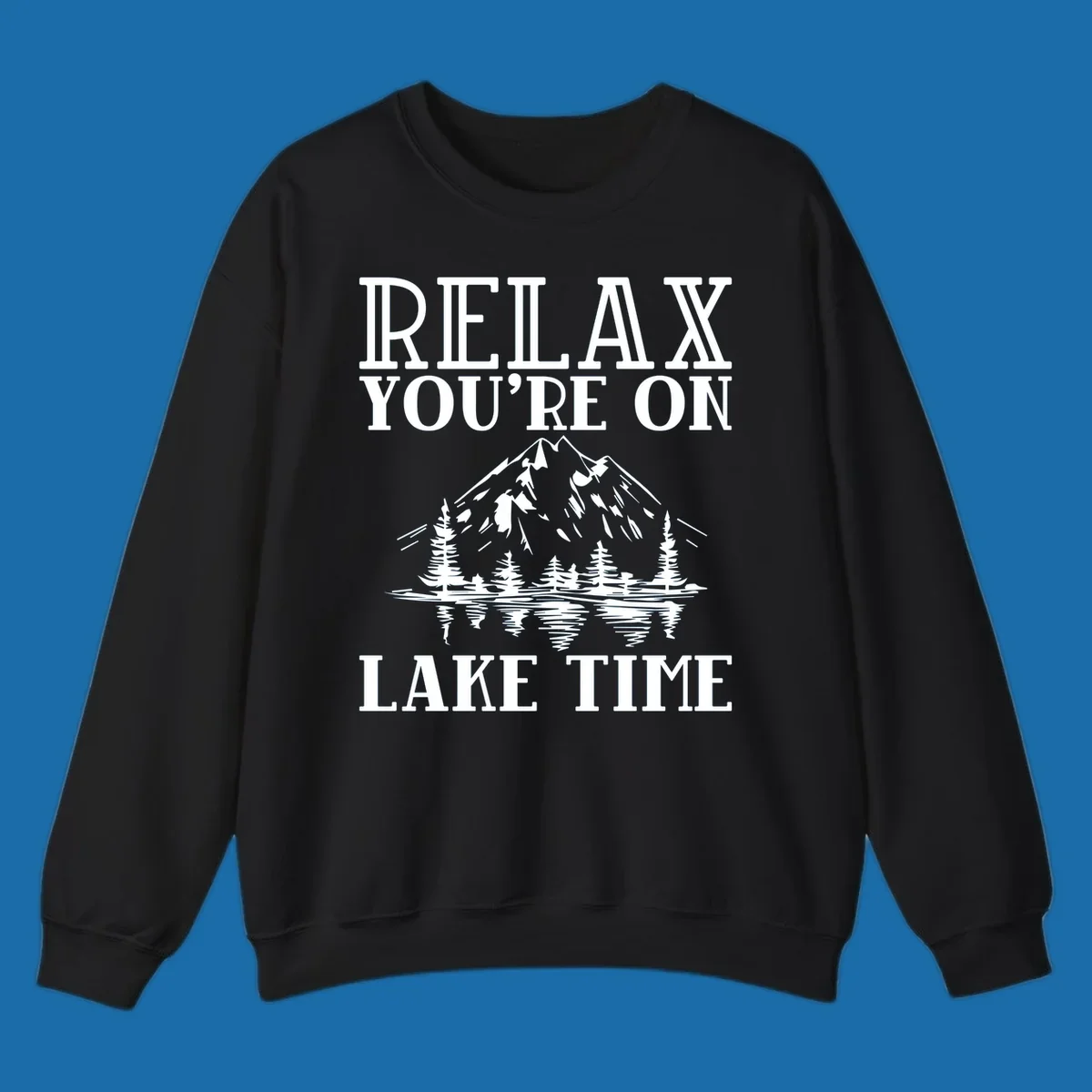Relax You're On Lake Time text with mountains, trees, and lake reflection.