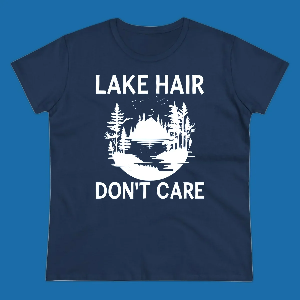 Lake Hair Don't Care design featuring a silhouette of a lake, trees, and mountains.