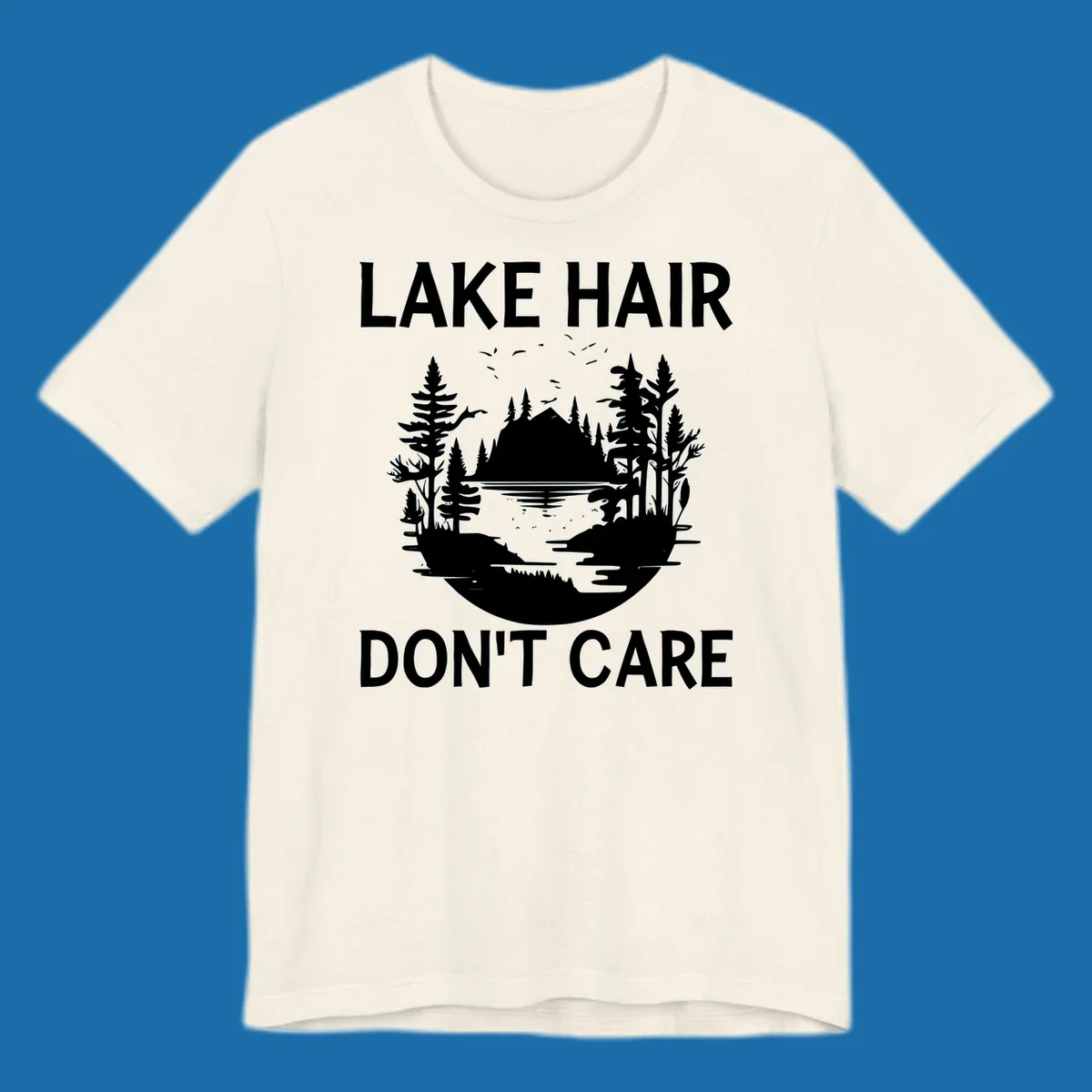 Lake Hair Don't Care design featuring a silhouette of a lake, trees, and mountains.