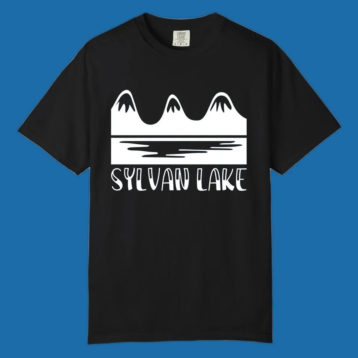 Sylvan Lake mountains reflected in water, with text 'SYLVAN LAKE'.