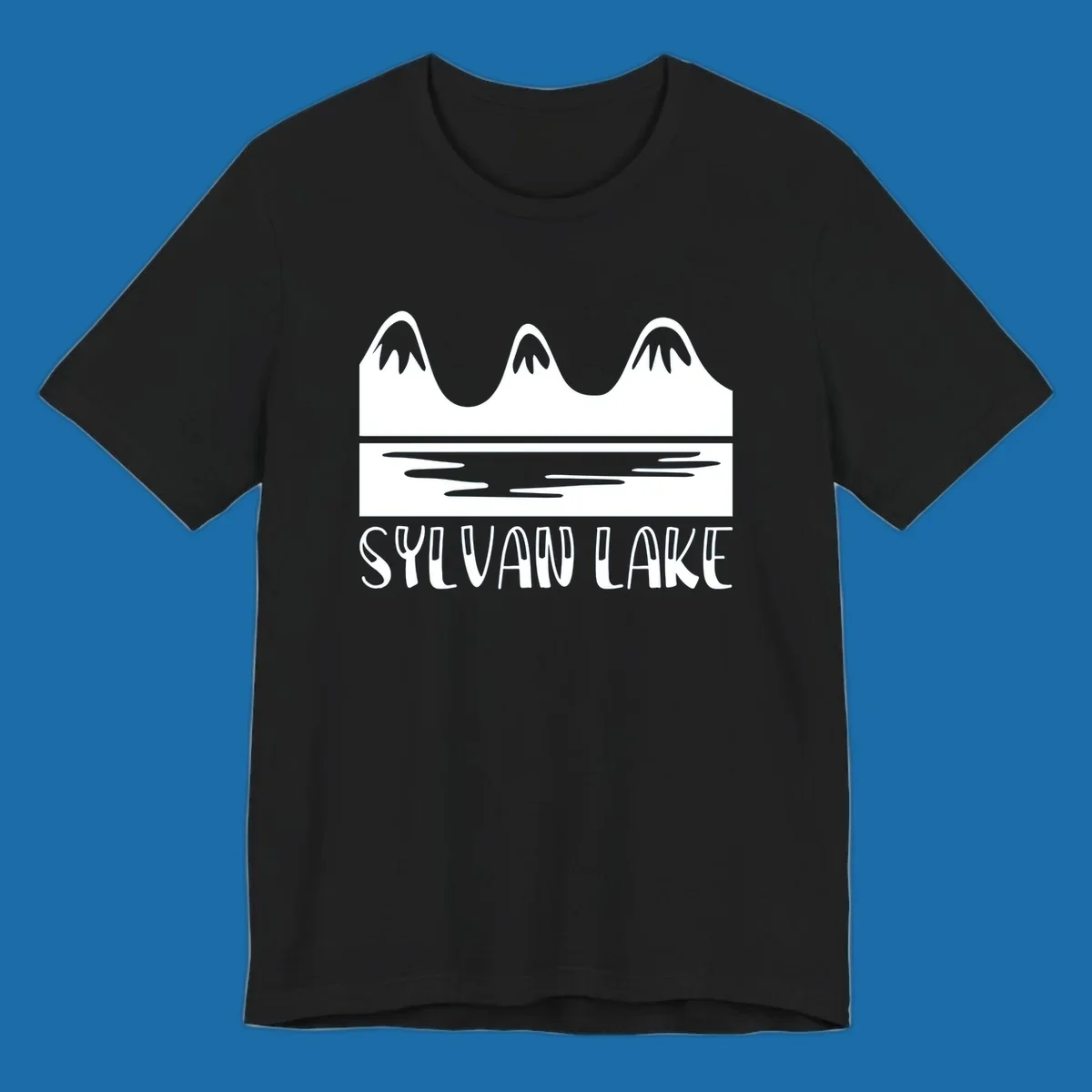 Sylvan Lake mountains reflected in water, with text 'SYLVAN LAKE'.