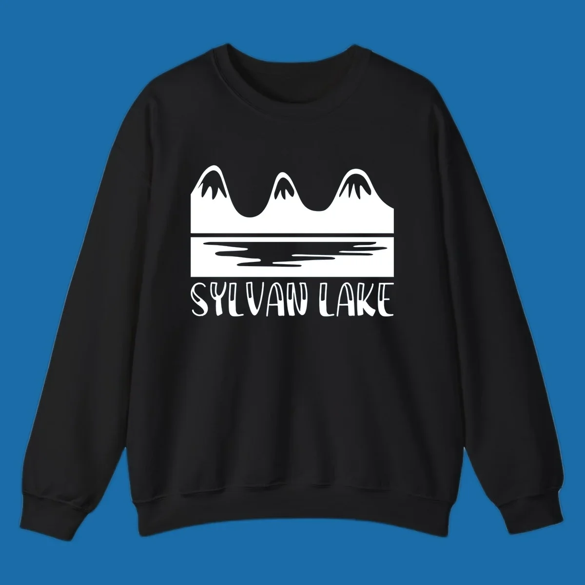 Sylvan Lake mountains reflected in water, with text 'SYLVAN LAKE'.
