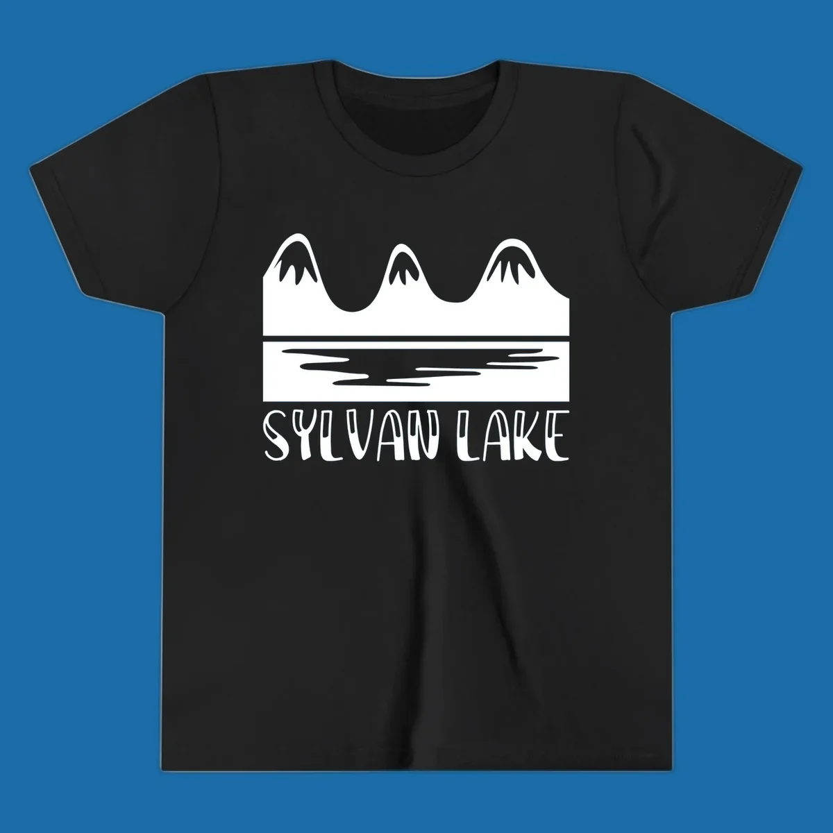Sylvan Lake mountains reflected in water, with text 'SYLVAN LAKE'.