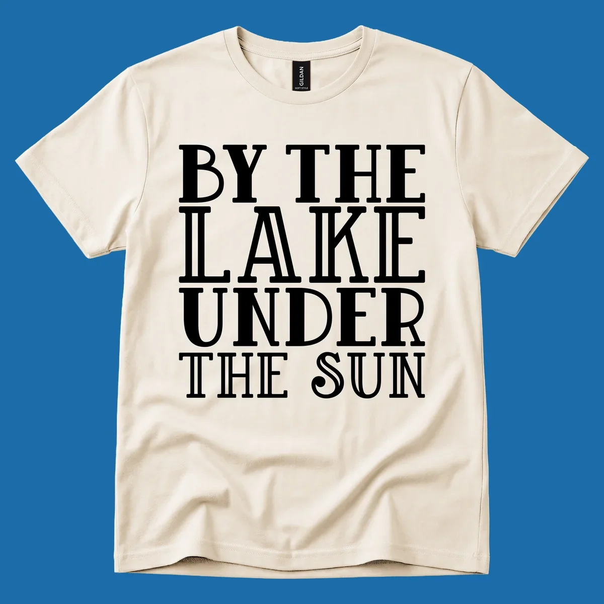Text design 'BY THE LAKE UNDER THE SUN' in white serif font.