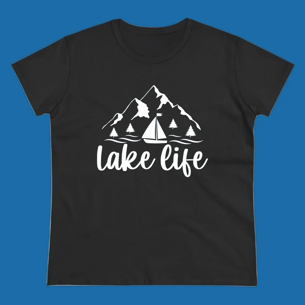 Lake life mountain sailboat scenic design with mountains, trees, sailboat, and text.