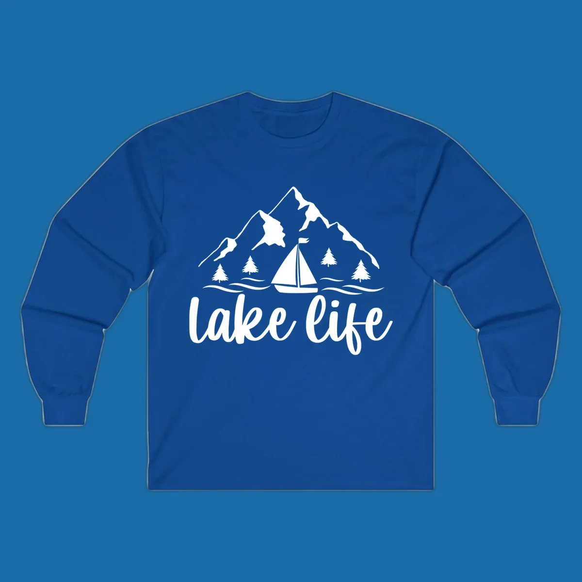 Lake life mountain sailboat scenic design with mountains, trees, sailboat, and text.